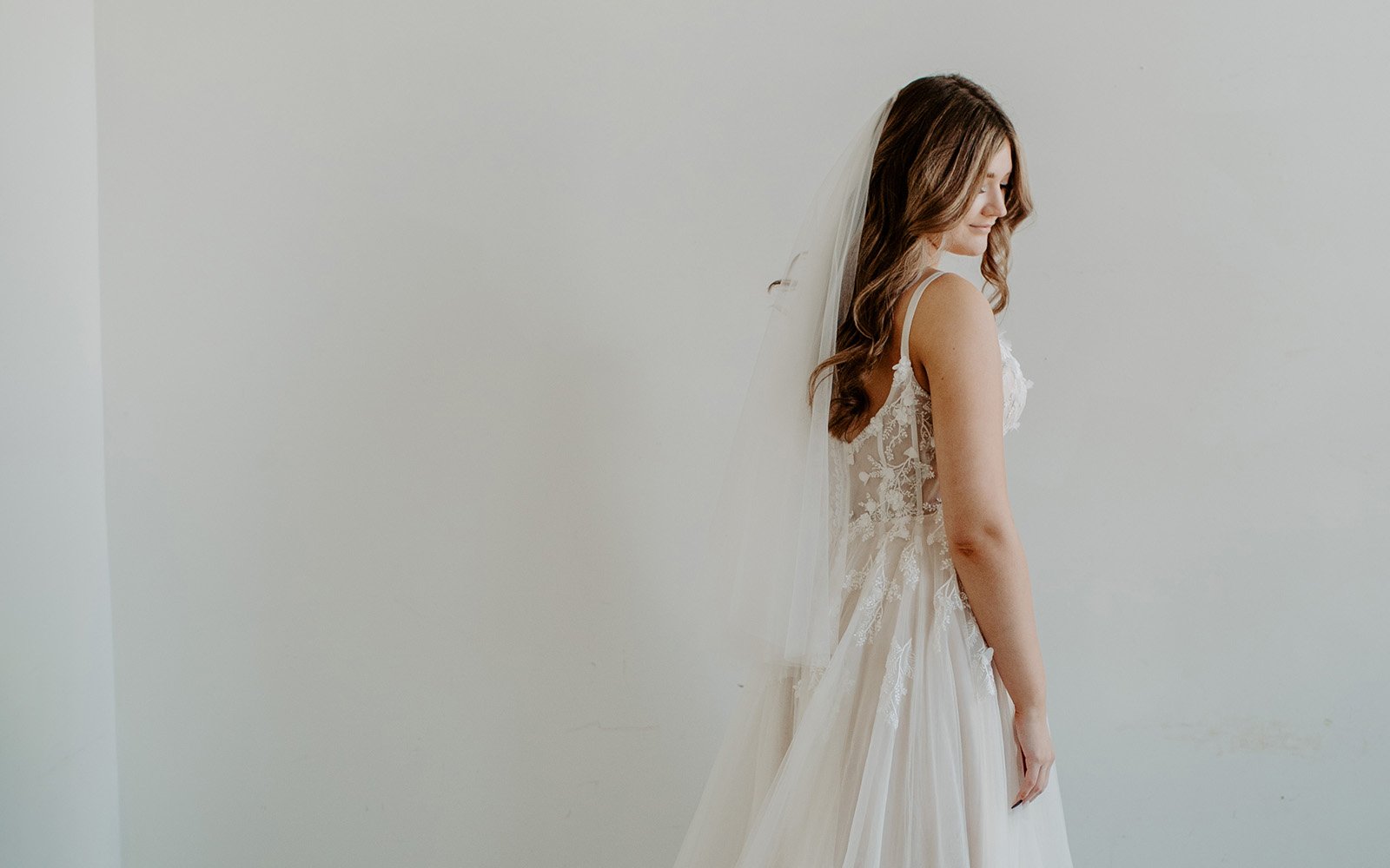 https://ruffledroseveils.com/wp-content/uploads/2023/03/Ruffled-Rose-Veils-Ottawa-Canadian-handmade-bridal-veil-blonde-bride-wearing-lace-dress-and-simple-classic-veils.jpg
